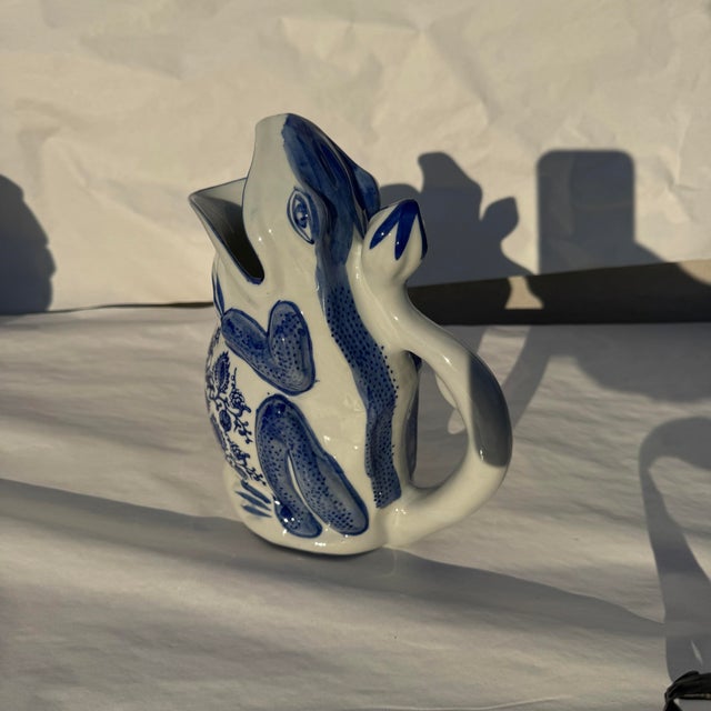 Blue and white frog pitcher in great shape. Likely Made in China. It’s a fun piece. Might even be a good piece to use as a...