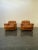 Pair of armchairs produced in 1970 by Vavassori of Monza in cognac-colored leather. Despite their age, signs of use are...