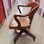 Bring a touch of historic American craftsmanship to your workspace with this quintessential vintage banker's office chair...