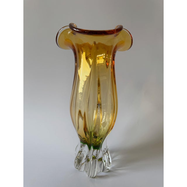 Large sculptural Egermann art glass vase produced in Czechoslovakia in the 1980s. The piece features a luminous amber...