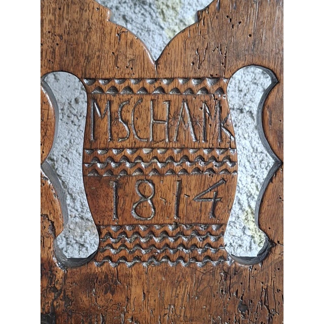 Magnificent solid wood chair from the german folk furniture tradition (bauernstuhl), dating precisely from 1814. This...