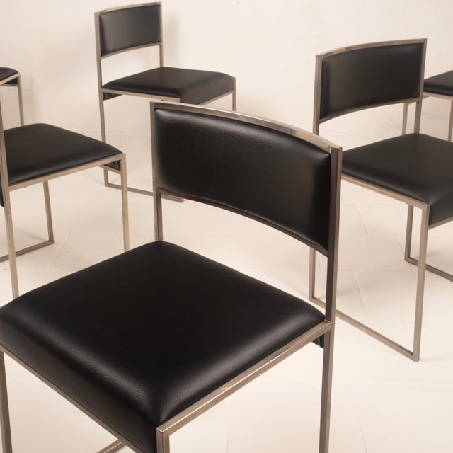 A striking set of six sq dining chairs designed in italy in the 1970s, distinguished by their rigorous geometric...