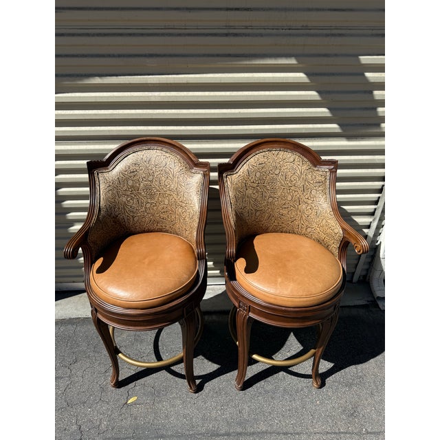 A handsome pair of Savoy swivel bar stools by Century Furniture, crafted in Hickory, North Carolina. These stools feature...