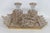 This gorgeous 4pc Vanity Set is made of carved glass and gilded metal. This stunning Hollywood Regency set comes with 2...