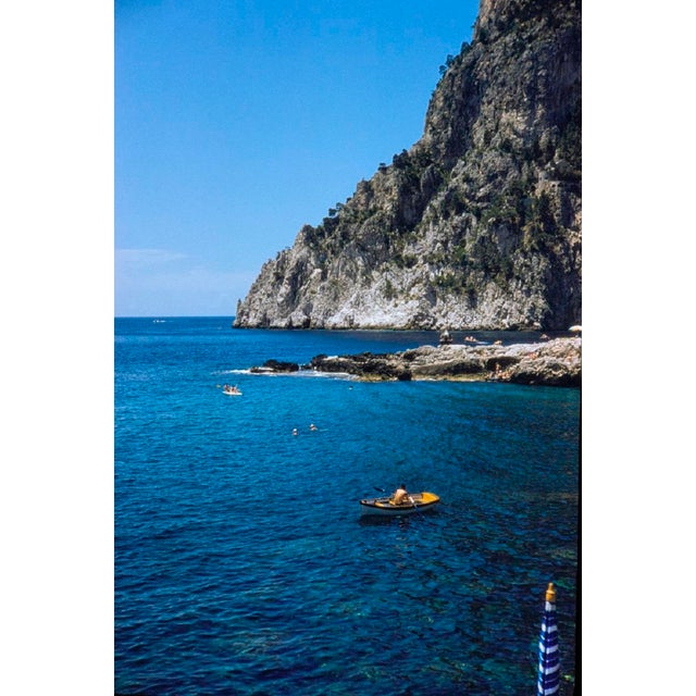 Capri Rowboat by Toni Frissell A boat on the blue waters of a Capri cove, 1959. (Toni Frissell) Archival Pigment Print 40...
