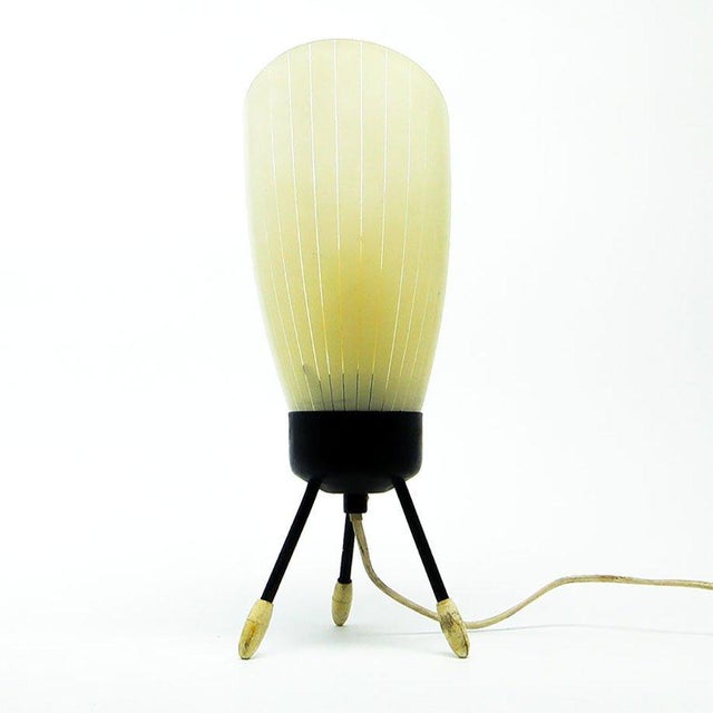 The bedside lamp comes from Polish from the 60s. It has a glass shade and metal legs. It is preserved in good condition....