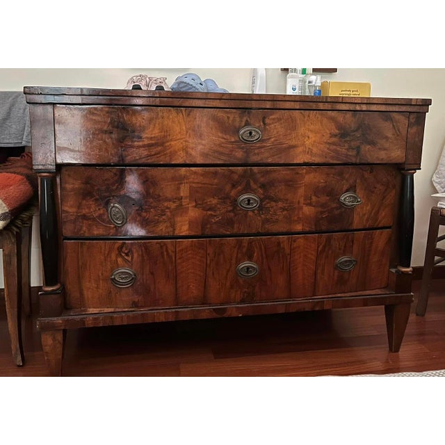 Dresser, chest of drawers from Empire period. The cabinet has 3 drawers, the upper one is straight while the two below are...