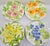 A beautiful vintage set of 12 Shafford Fleurs du Jour dessert or salad plates, dated 1988. This cheerful, sculptural...