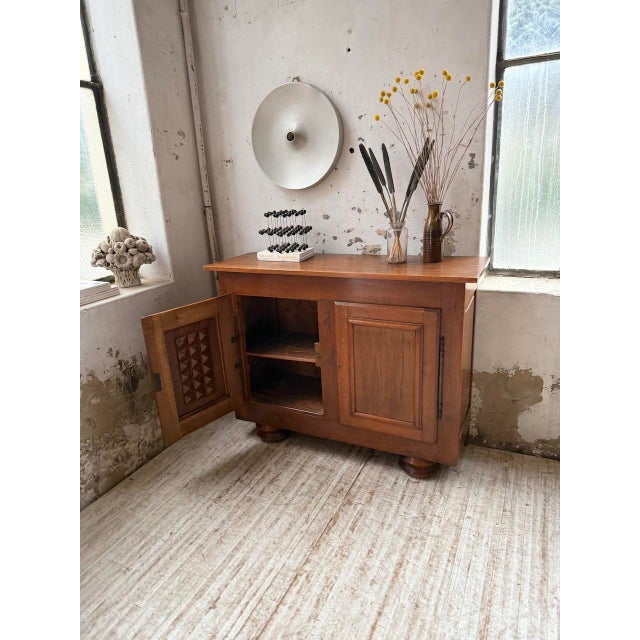 Vintage 1940s solid oak storage unit in the charles dudouyt style. we love the color and grain of the wood, which lend it...