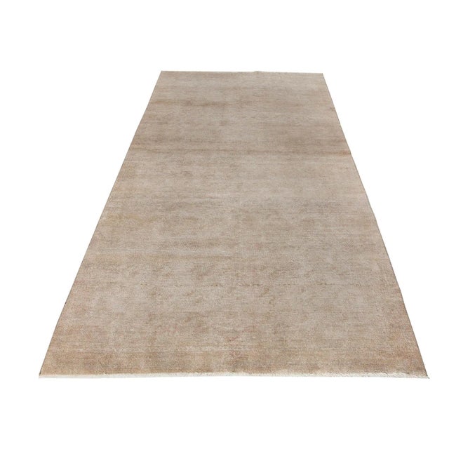 Decorative washed out handknotted vintage rug from Konya region of Turkey. Approximately 50-60 years old. In very good condi.