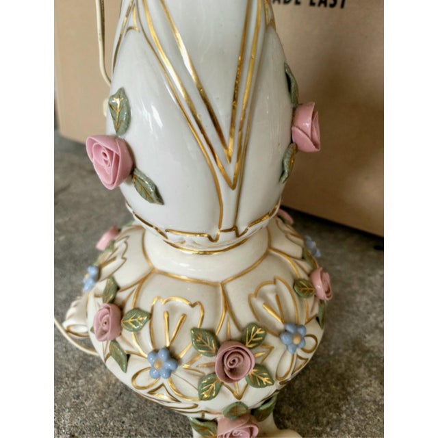 Vintage porcelain lamp with original fabric shade. Vibrant pink, blue, green and gold accents.