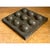 This vintage abstract sculpture presents a compelling study in industrial minimalism, its square metal form punctuated by...