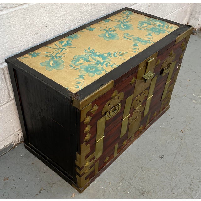 Bring a sense of history and refined craftsmanship into your home with this antique Korean bandaji chest, a beautifully...
