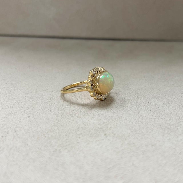 Syna Yellow Gold Ethiopian Opal Oval Ring with Diamonds For Sale - Image 4 of 5