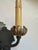 Pair of duel arm Regency style iron sconces with brass bobeches having wonderful vintage gilt and paint on some surfaces....