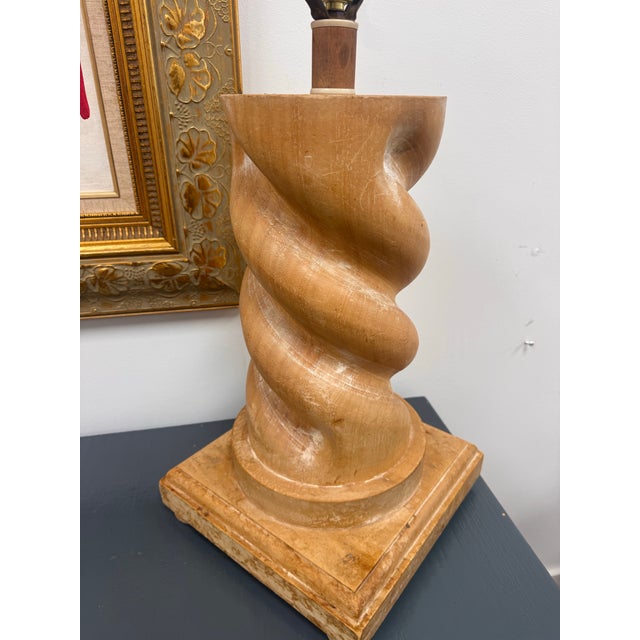 A handsome vintage wood table lamp featuring a bold spiral-carved body and substantial square base. Done in the style of...