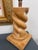 A handsome vintage wood table lamp featuring a bold spiral-carved body and substantial square base. Done in the style of...