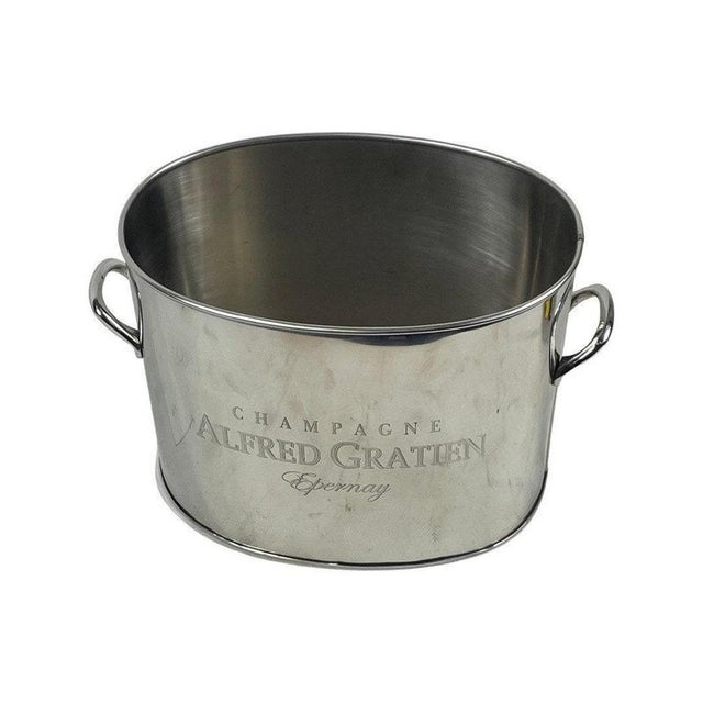 Champagne cooler or ice bucket made for Alfred Gratien Epernay. with a carved logo in the centre amd two handles on the...