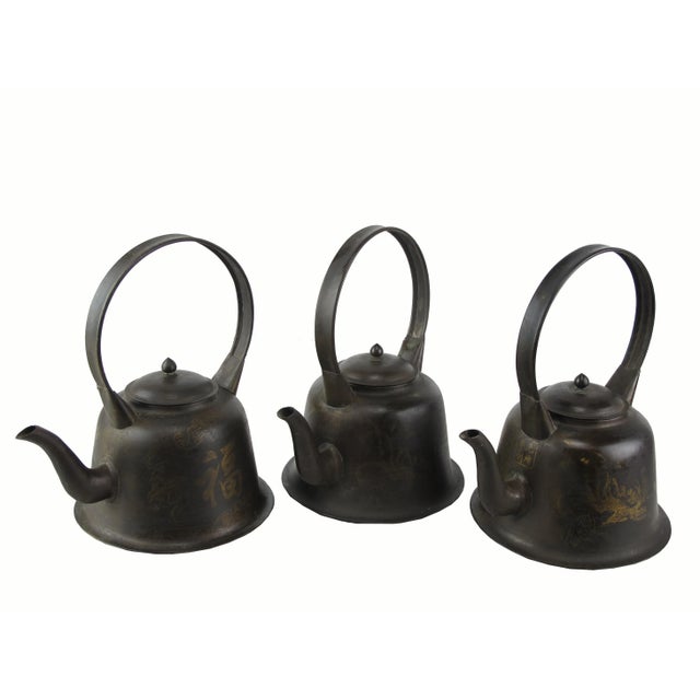 Those 3 light copper tea pots are reproduction of traditional Chinese teapot. They are hand made with hand painted Chinese...