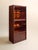 A beautifully crafted rosewood curio cabinet with rich, expressive grain and warm interior lighting. Glass shelving and...