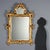 This 20th-century mirror imitates Venetian mirrors from the mid-18th century. Engraved throughout the frame with rocaille...