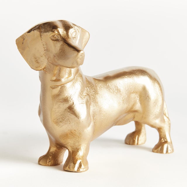 Made of a heavy cast aluminum using a centuries old sand cast method, this regal dachshund sculpture is worthy of a prime...