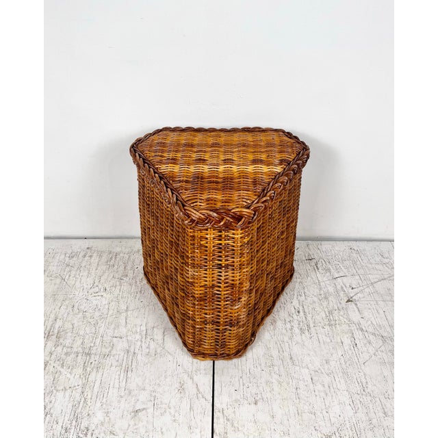 Vintage Wicker Works style wicker rattan side table. Woven thick reed triangular table with braided wicker trim.
