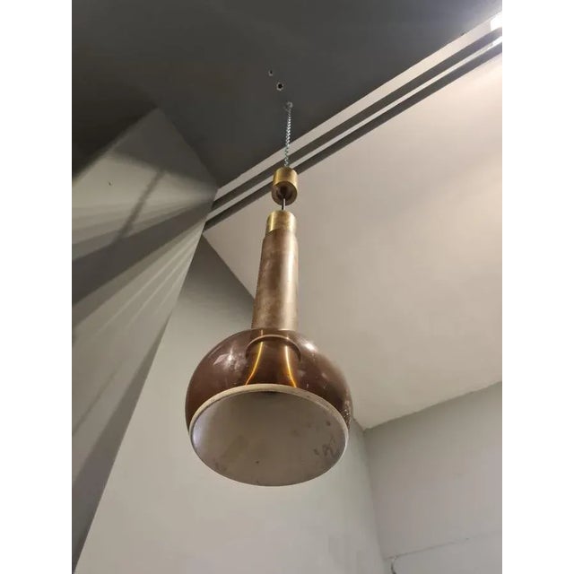 Pair of brass and wood chandeliers, Italian production of the 60s, attributable for style and construction quality to the...