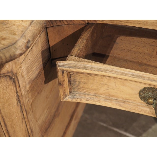 Hand-carved, circa 1720, using chestnut and oak woods, this desk was recently part of Le Grand Monarque hotel in Chartres,...