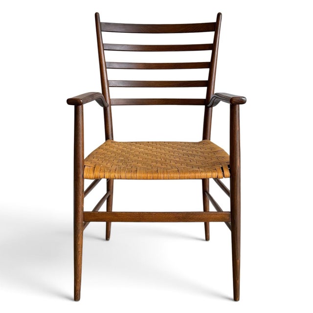 A sculptural Italian armchair confidently attributed to Chiavari, this elegant mid-20th century design exemplifies the...