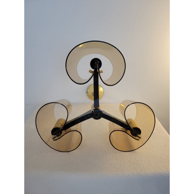 A truly exceptional and rare opportunity to acquire a matching set of vintage Space Age chandeliers designed by Michel...