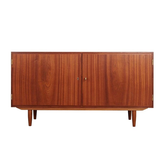The cabinet was made in the 1970s by the Danish manufacturer Hundevad & Co. It was designed by the renowned designer Carlo...