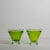 A lively pair of hand-blown cocktail glasses featuring a vibrant lime green hue and tiny bubbles throughout the glass....