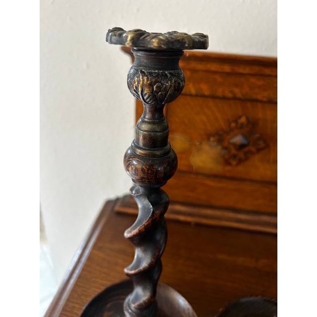 Pair Tiger Oak Barley Twist Candlesticks with Brass Bobeches (candle holders), featuring a classic British style from the...