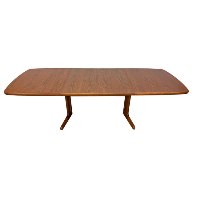 Elevate your dining space with this vintage Danish Modern teak dining table, circa 1980s. Featuring classic Scandinavian...