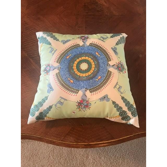 This decorative square silk throw pillow features the iconic Hermes design. It is an example of luxury upcycling, where a...