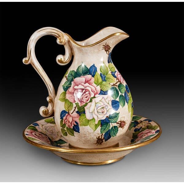 Handcrafted in Italy, this elegant ceramic pitcher and matching basin set features a richly detailed hand-painted rose...