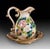Handcrafted in Italy, this elegant ceramic pitcher and matching basin set features a richly detailed hand-painted rose...