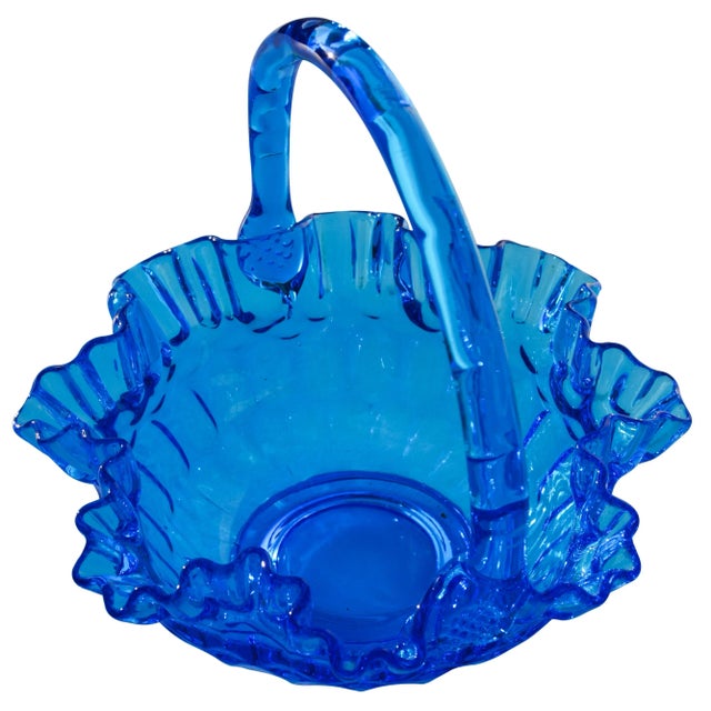 Midcentury handblown blue glass basket with ornate structure and intricate details. This beautiful accent ships within 1-2...