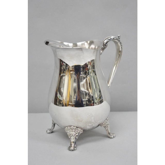 Vintage Kent Silversmiths Silver Plated Bulbous Victorian Rose Pattern Footed Water Pitcher. Circa Mid 20th Century....