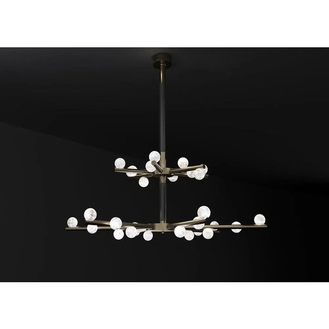 Demetra brushed burnished metal double chandelier by alabastro italiano dimensions: d 85 x w 97 x h 96 cm. Materials:...