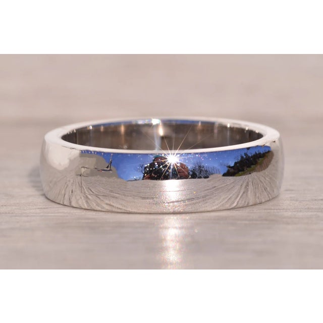 The Super: Cliq Signed Hinged Band in White Gold. Crafted with precision, this polished half dome top band exudes timeless...