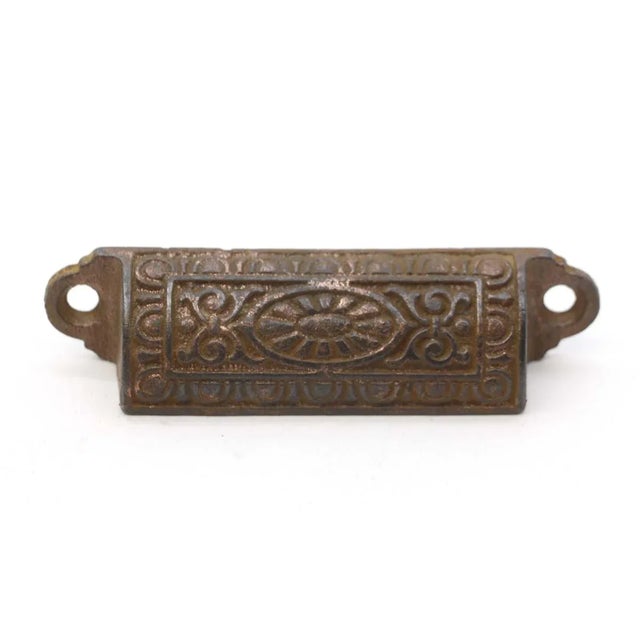 Antique Victorian style cup bin drawer pulls made of cast iron with a black finish. Original mounting screws are not...