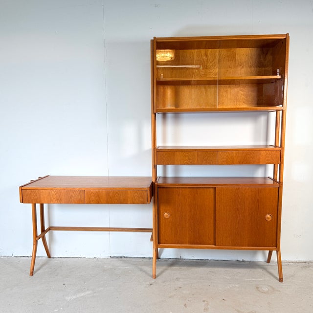 A distinctive mid-century wall unit from the former Czechoslovakia. Designed by František Jirák for Tatra Nábytok in the...
