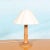 Organically designed atmospheric lighting from the seventies. The lamp has a round solid wooden base made of spruce wood,...