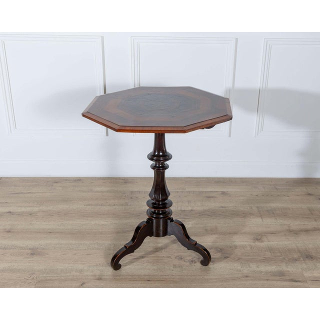 An exquisite Empire octagonal sail table, crafted in Milan during the first half of the 19th century, showcasing the...