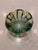 A heavy, vintage art-glass bowl in luminous shades of emerald green, aqua and deep turquoise. Its thick, substantial glass...