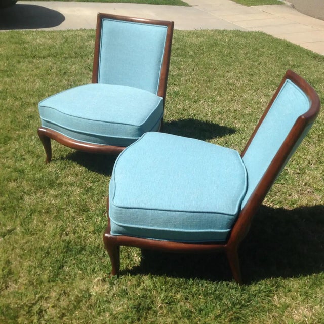 Modern mid-century style slipper lounge chairs in the manner of Robsjohn Gibbings. These chairs were made in the style of...
