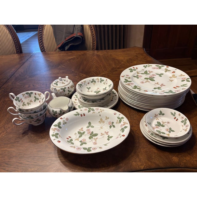 Wedgewood bone china in a beautiful Wild Strawberry pattern. An eclectic mix of dishes. Plenty of dinner plates and some...