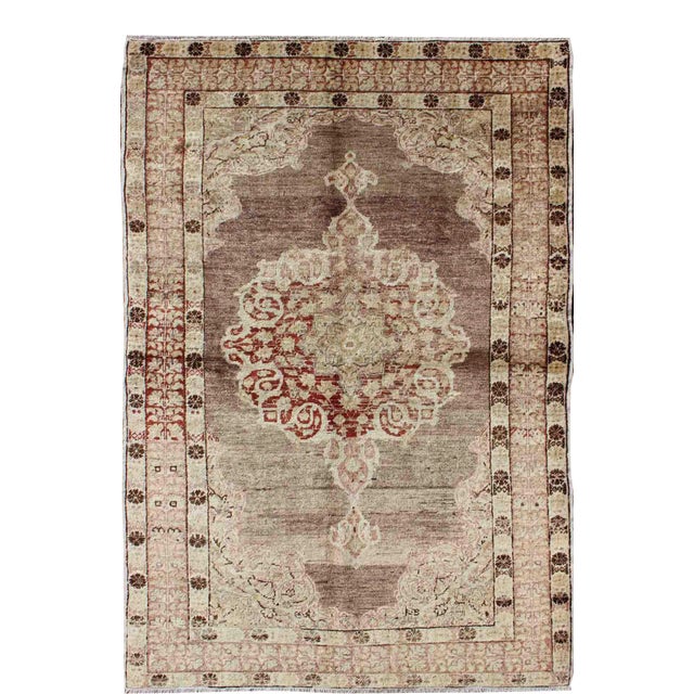 Vintage Turkish Oushak Rug With Faded Plum and Cream Tones 4′ × 6′3″ For Sale